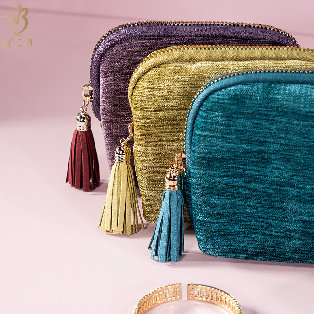 Close-up of the velvet texture, metal zip and tassel pull