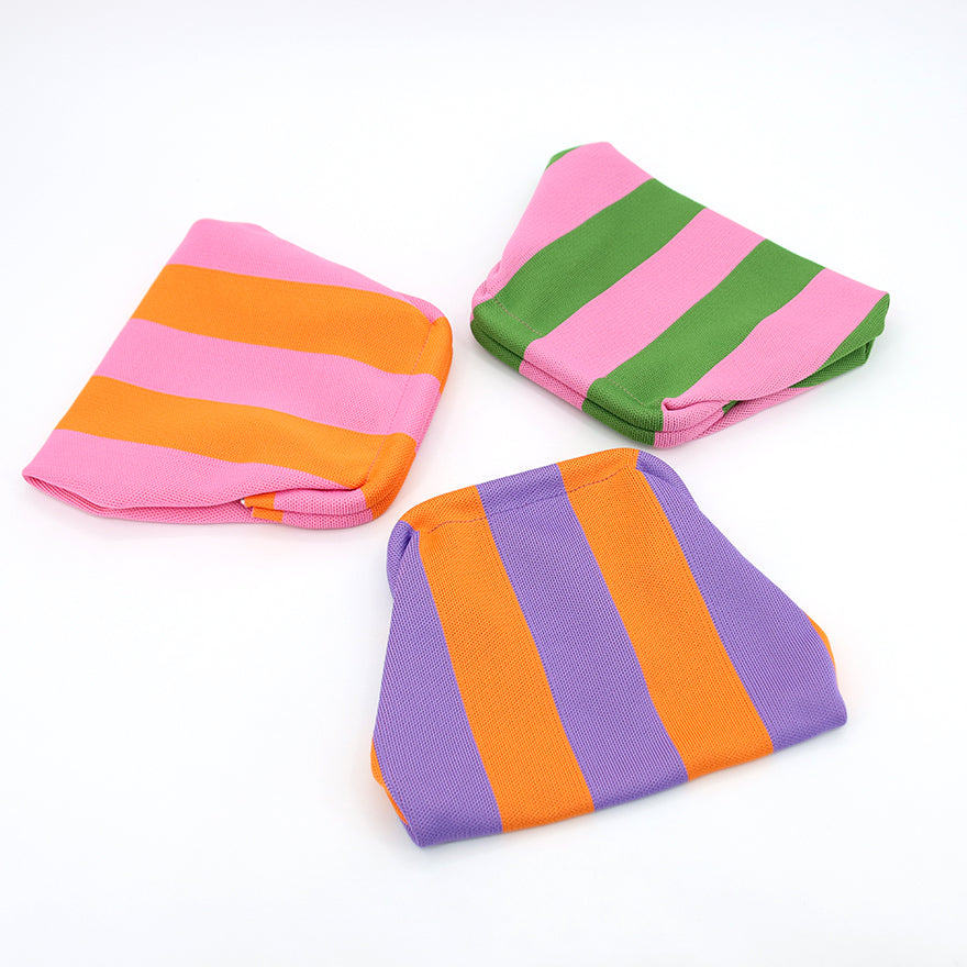 Three clutches folded flat for packing