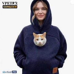 Navy pet pouch hoodie worn with the hood up and a cat in the pouch