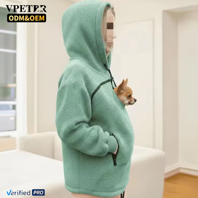 Mint pet pouch hoodie with a small dog looking out of the side of the pouch