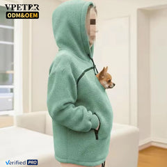 Mint pet pouch hoodie with a small dog looking out of the side of the pouch