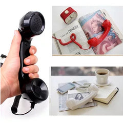 Holding the black retro handset, and the handset styled on a desk with books